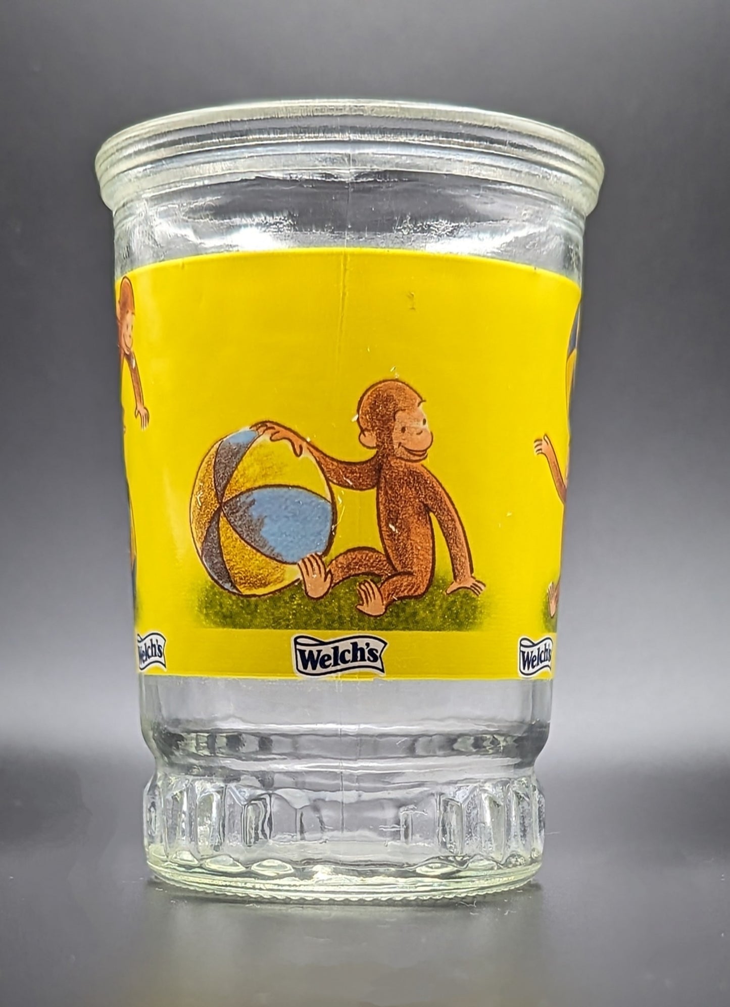 Curious George Welch's Juice Glass Jar #4 Balancing On Inflatable Striped Ball